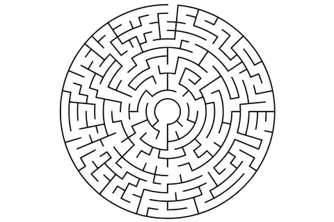 Circular maze in black and white with curved paths and a highlighted orange solution line.